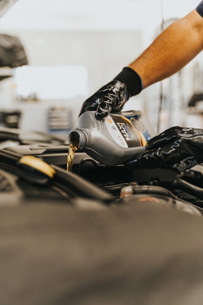 Close up of Pouring Oil to Engine